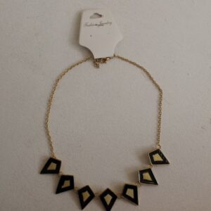 gold and black necklace with diamond shaped pattern