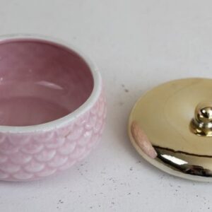 pink ceramic pot with gold lid