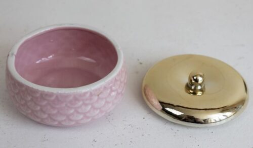 pink ceramic pot with gold lid