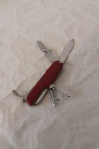 red pocket knife swiss