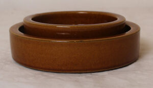 2 brown ceramic dishes